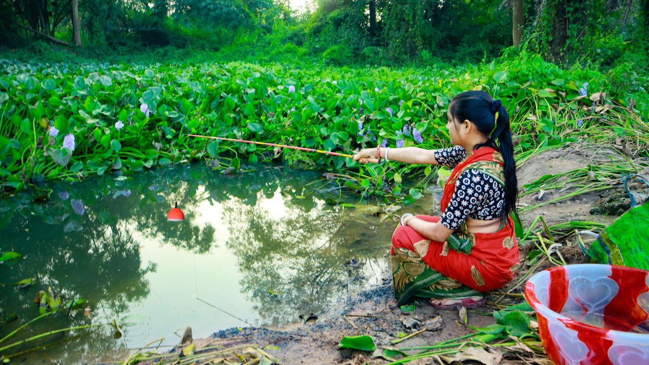 Fishing video || The brave village girl is fishing with a hook in a forest old ditch || Hook fishing