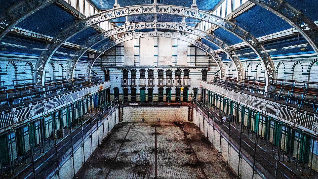 HIDDEN in this Building is a 100 YEAR OLD ABANDONED Swimming Pool