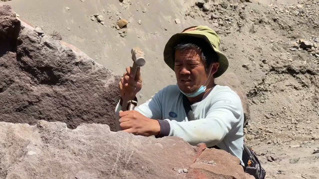 The miners load stones measuring 1m x 1m. || One truck can only carry two large stones.