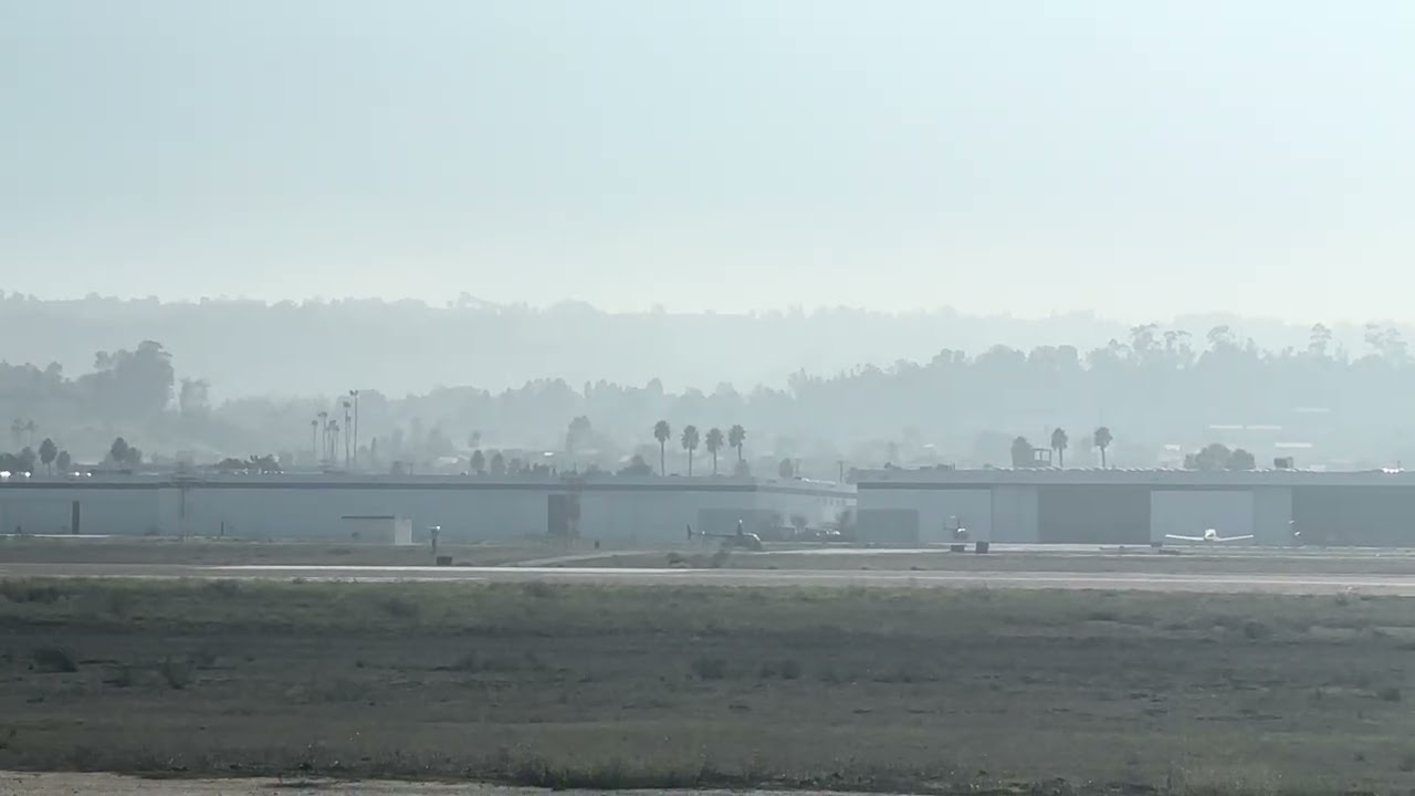 Robinson R44 Helicopter taking off from Torrance Airport 