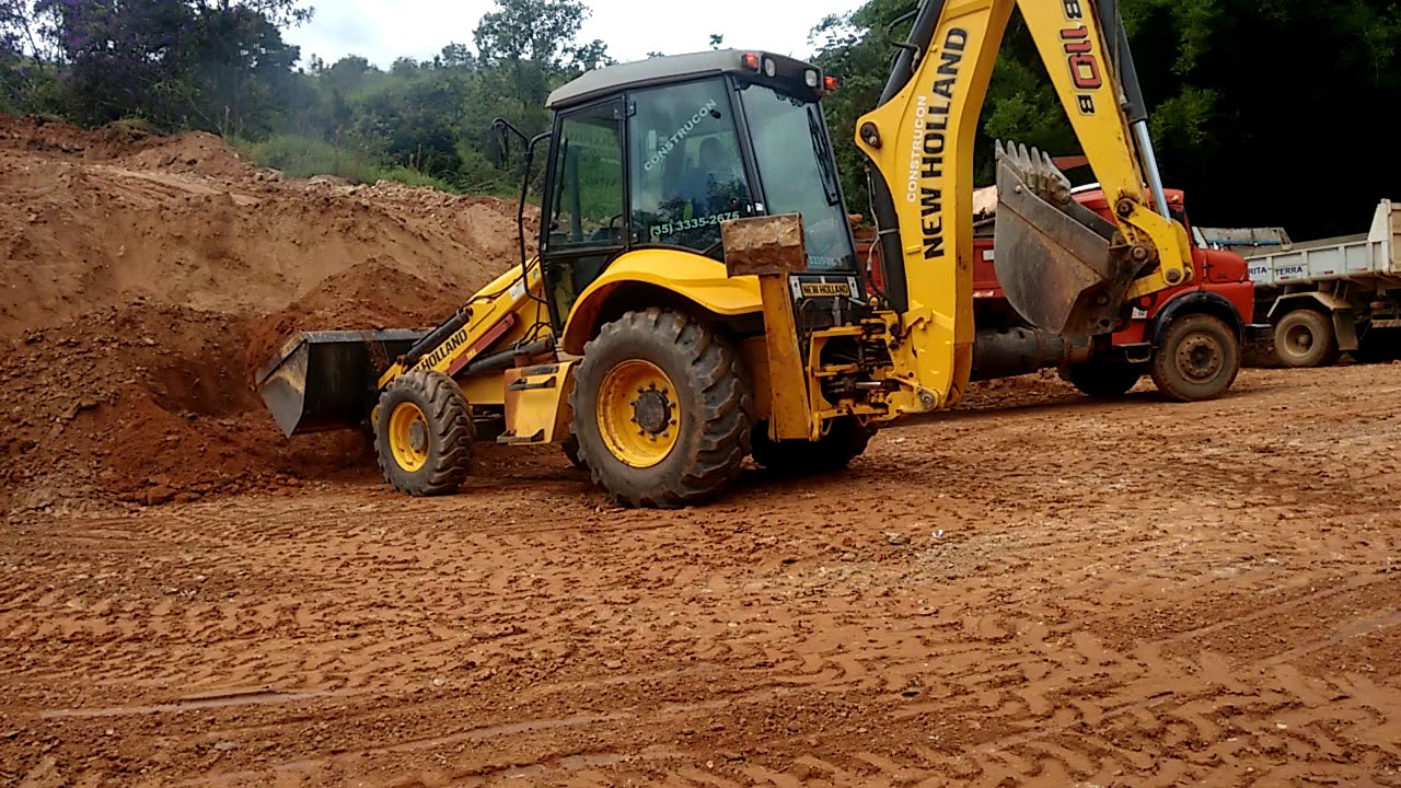 Carregamento de cascalho com retro B110B