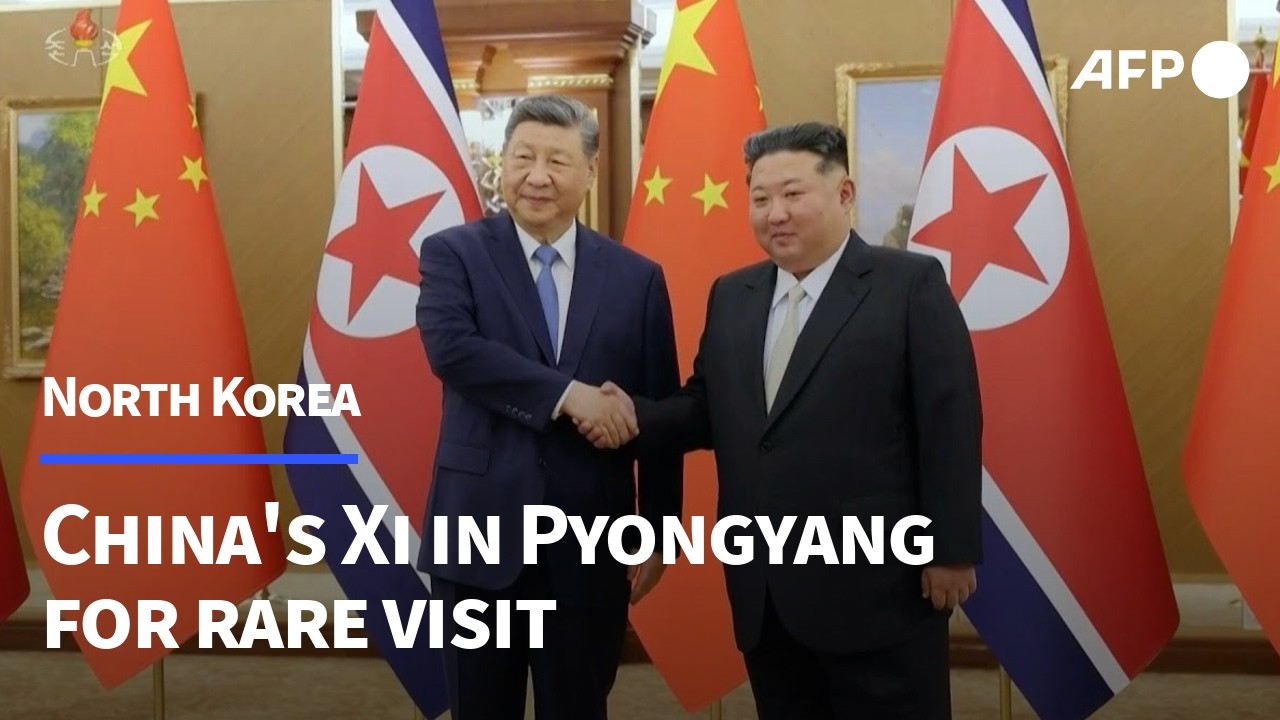 China's Xi in North Korea for rare visit | AFP