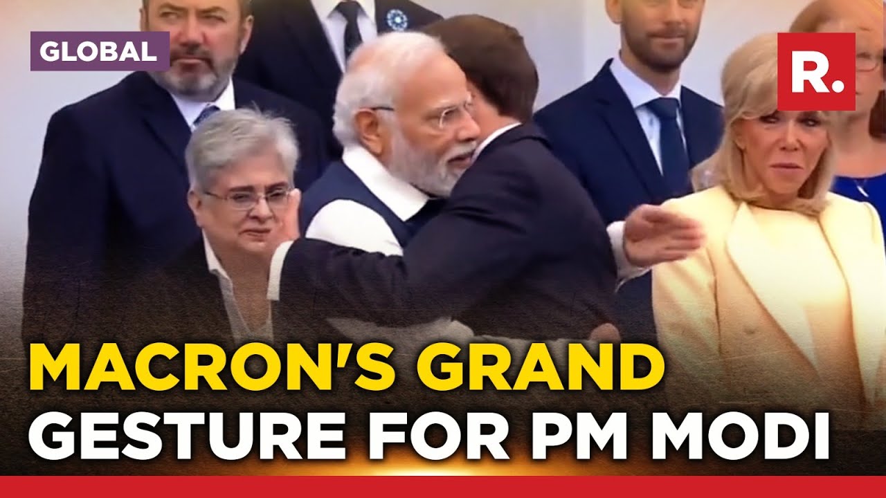 France's Macron walks up to hug PM Modi on Bastille Day