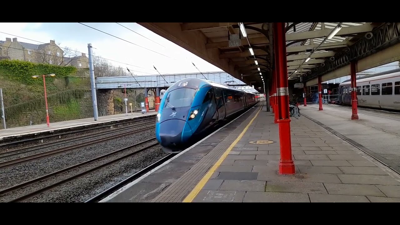 802219 heads north through Lancaster with 5s51 to Glasgow Central.