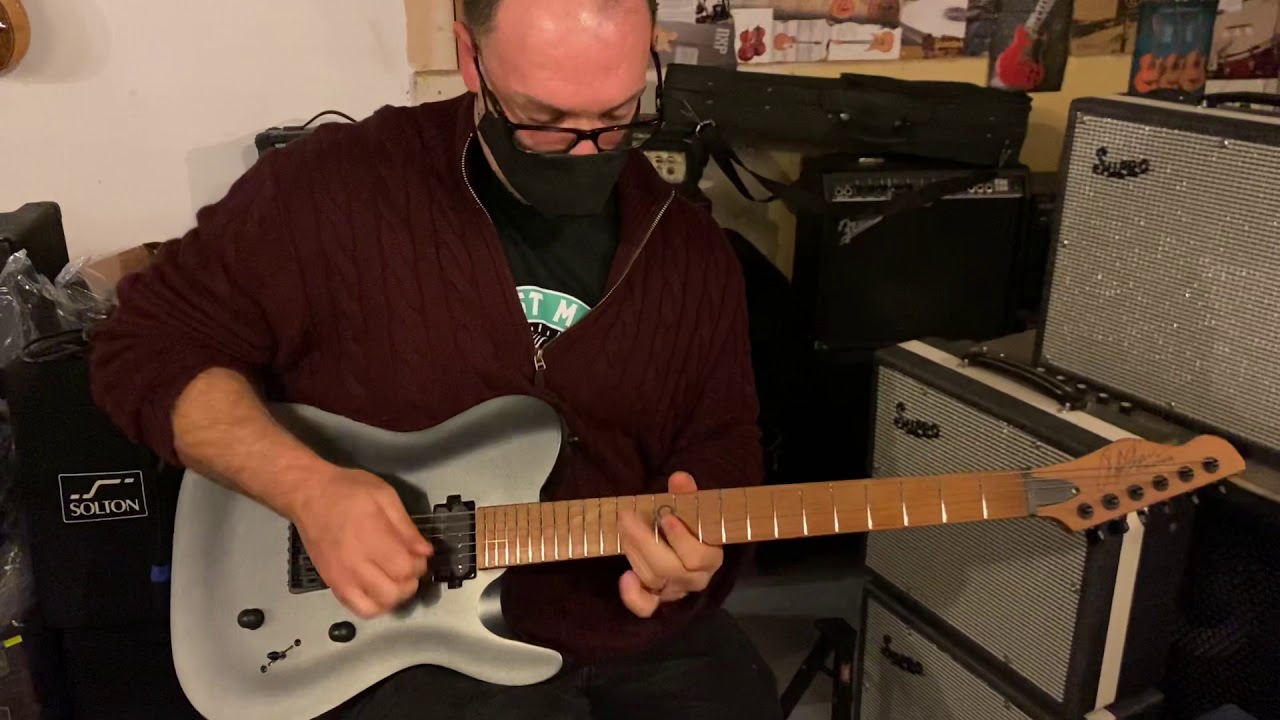 Rob Chapman testing out the ML3Pro Modern Cyber Black Prototype at Band Aid Music Malta