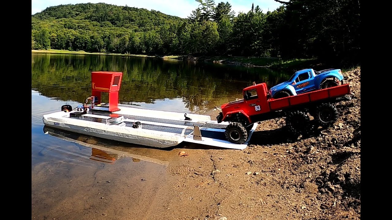 Rc truck 6x6 crosses a lake on a barge + short course brushless bashing.