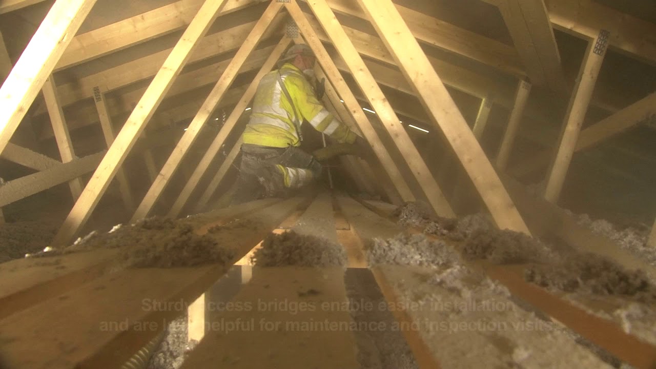 Installing Ekovilla on the attic floor