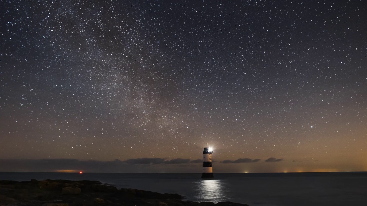 Penmon Point lighthouse and milkyway timelapse