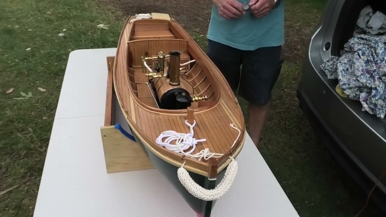 Nicely made scratch built RC steam launch has it's second run on the pond