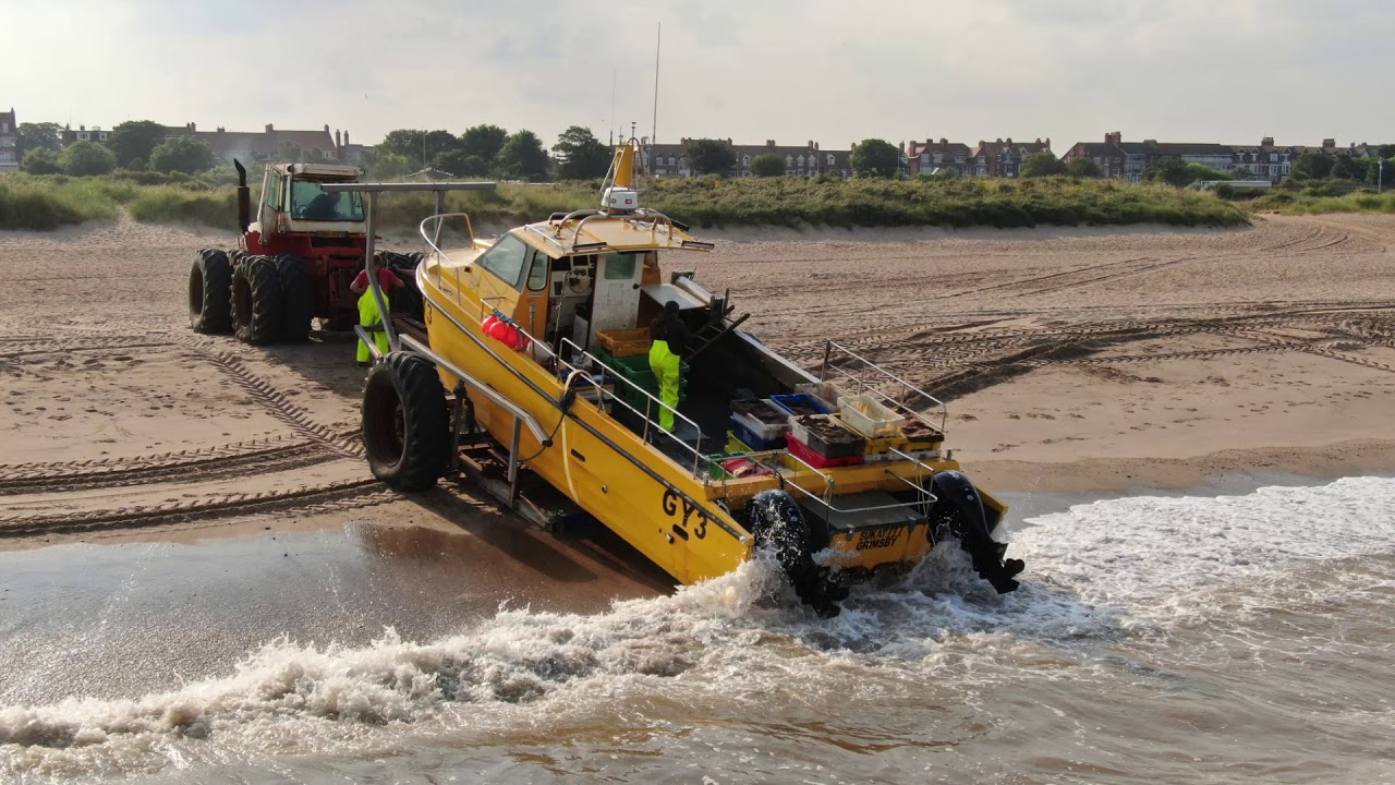 BIG YELLOW FISHING BOAT BEACH LANDING SKEGNESS LINCOLNSHIRE