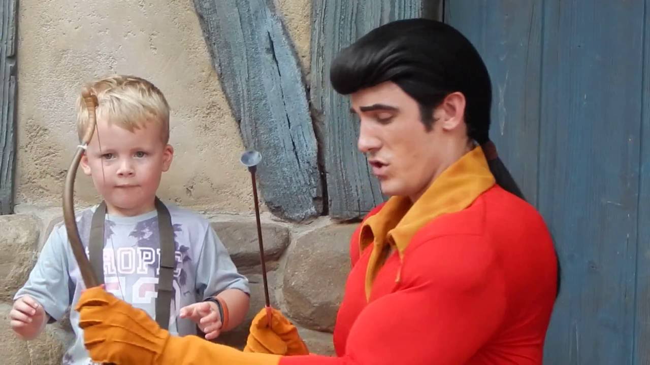 GASTON teaches tiny how to shoot bow & arrow Disney World Magic Kingdom