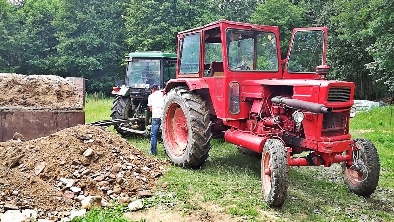 Universal 650M Tractor Unloading Sand From The Tippers