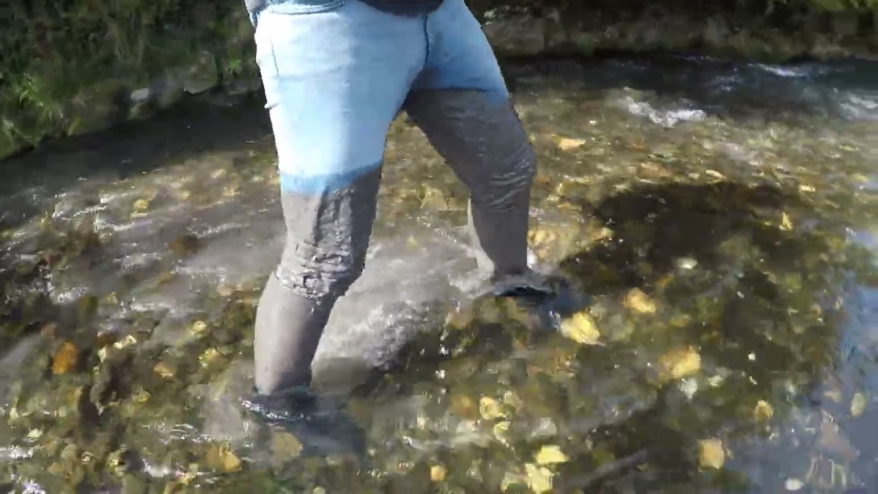 Muddy jeans and rubber boots