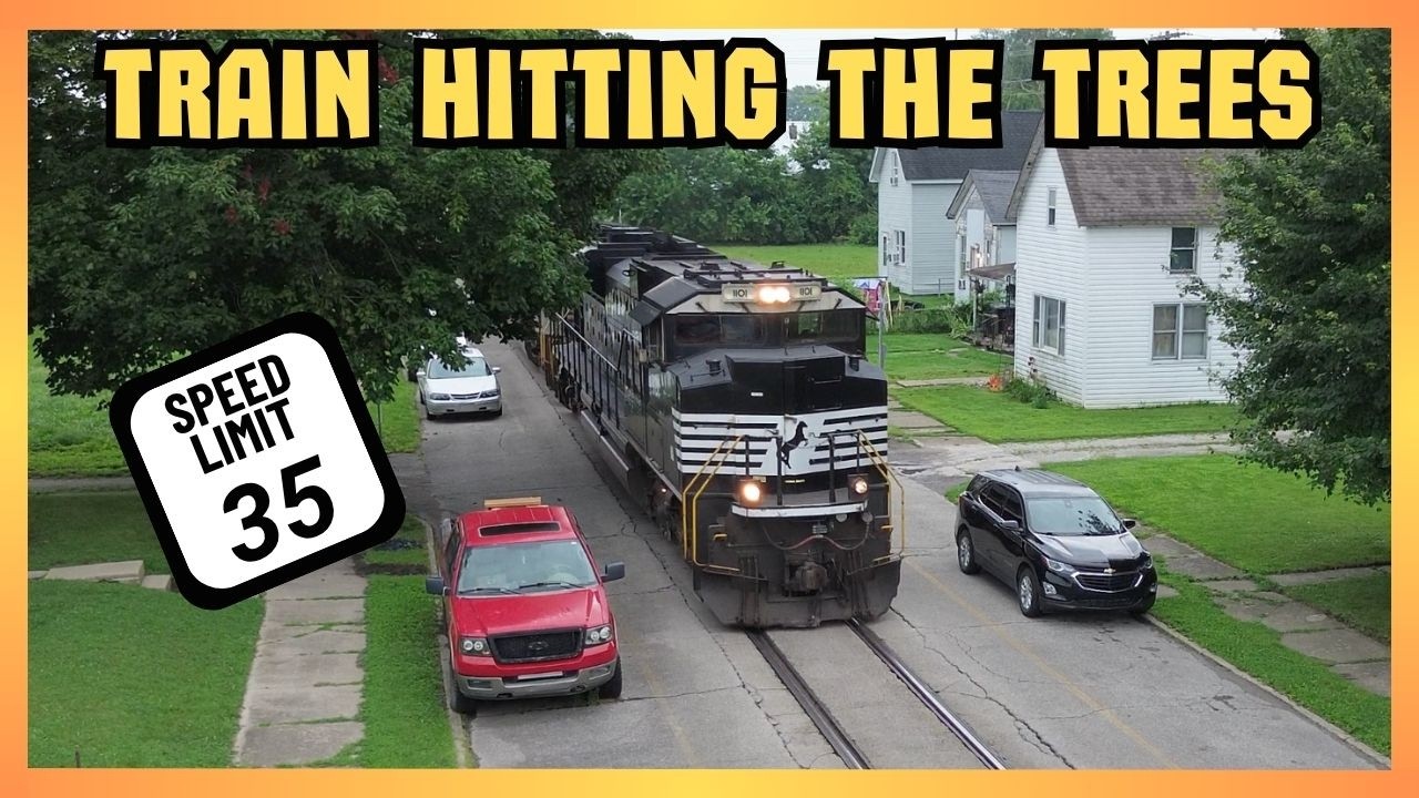 Derailment brings unexpected train through sleepy town as intermodal hits low hanging trees and...