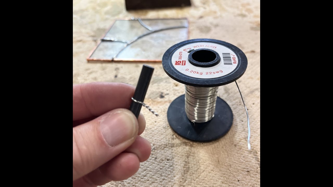 Making and soldering a wire loop on to a copper foiled stained glass panel