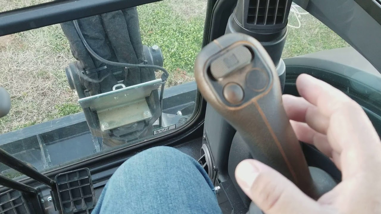 Inside the cab of 26G John Deere Mini excavator.