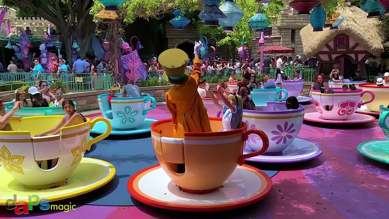 Alice in Wonderland and Mad Hatter on the Mad Tea Party at Disneyland