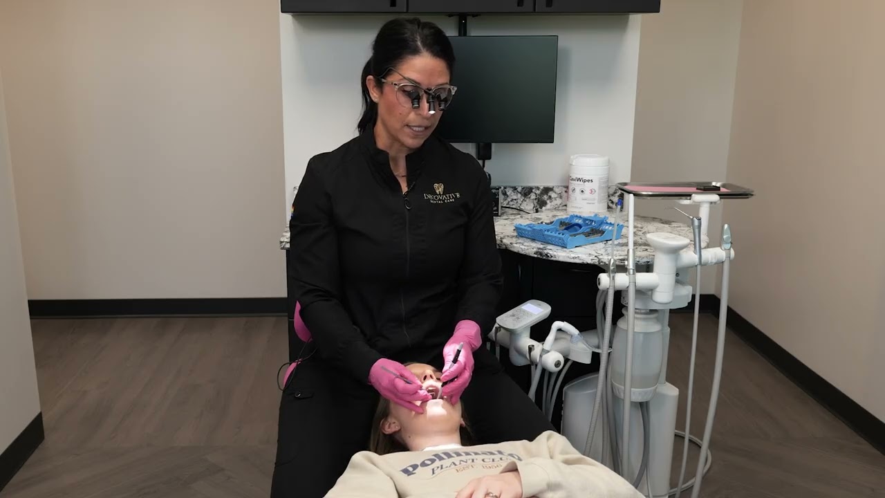 Orascoptic Ergonomic Dental Loupes - Hygienist using ego / deflection loupes for a periodontal probe
