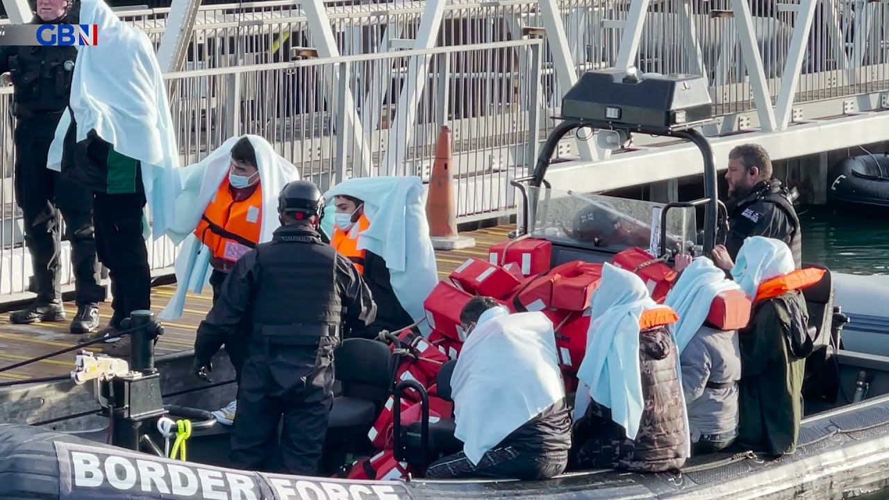Migrant crisis: UK Border Force and RNLI escort mainly men onto British shores