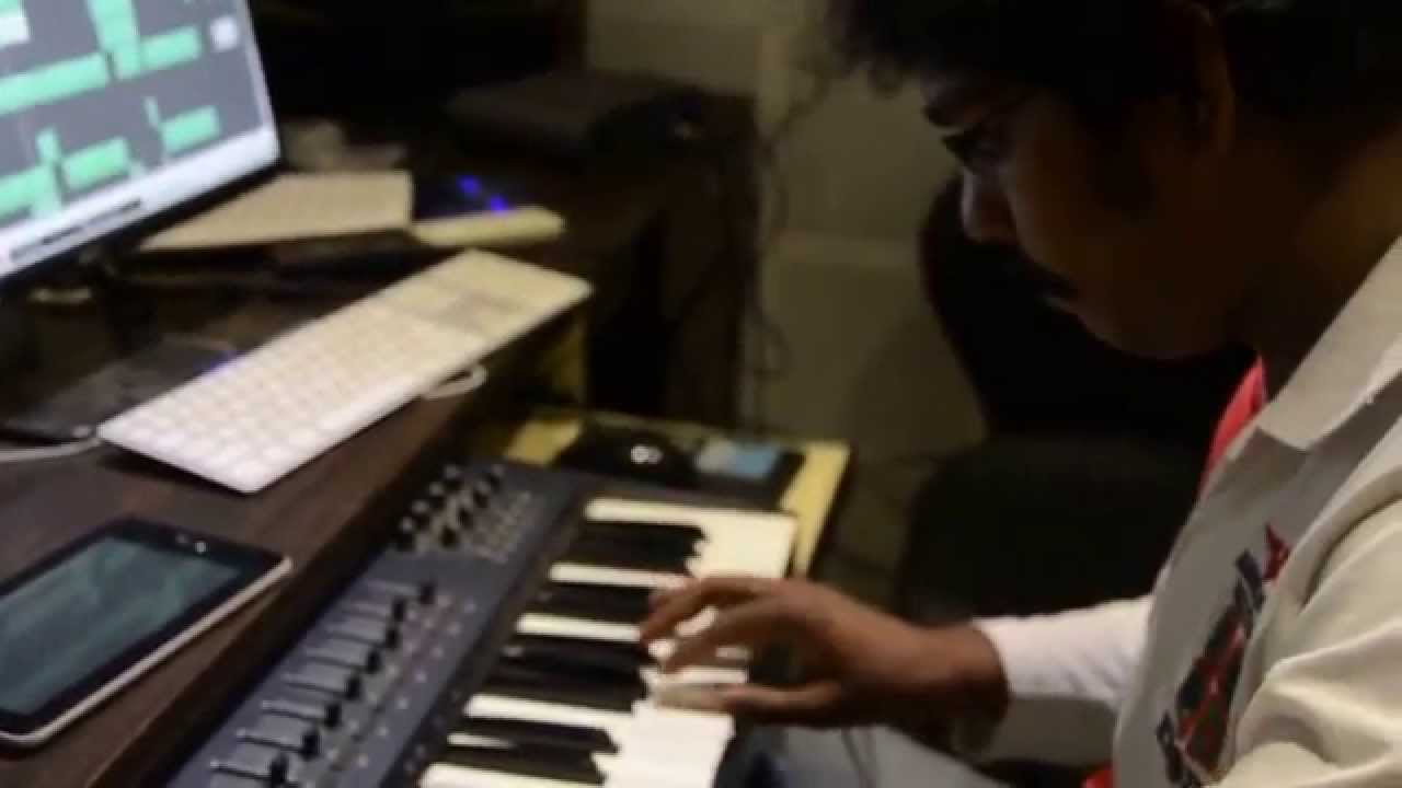 Suresh Joshua playing guitar on keys