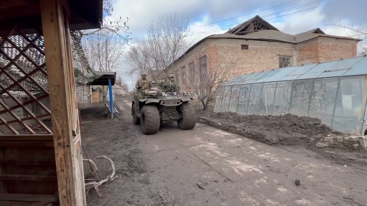 Russian fighters on a Yakt Sokol Pickup ATV