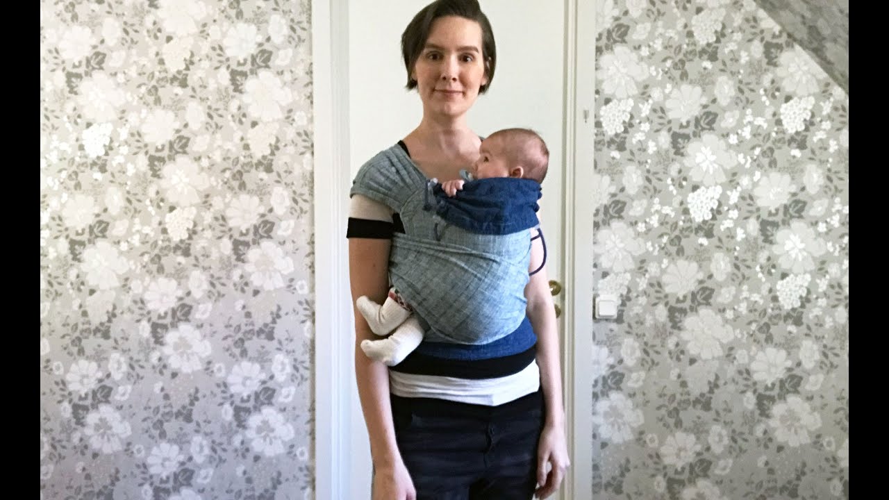 Meh Dai: Barnet sittandes åt sidan i knytsele (liten bebis)