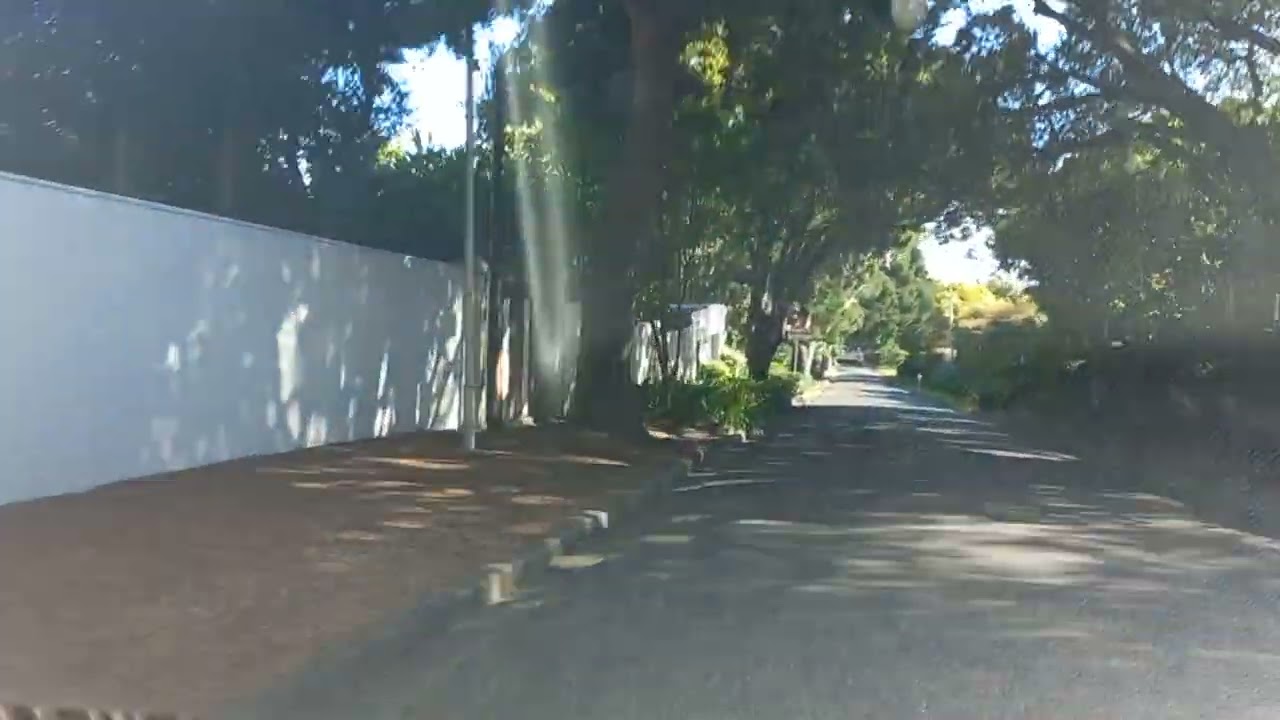 Driving through Bishopscourt to Kirstenbosch Gardens entrance on a December day in Cape Town