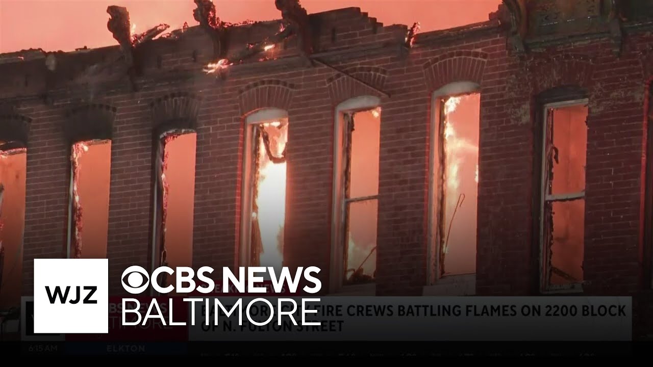 Crews battle fire massive rowhome fire in West Baltimore