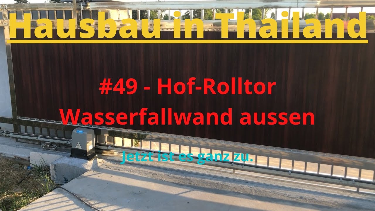 Hausbau in Thailand, #49 Hof Schiebetor und Wasserfallwand aussen