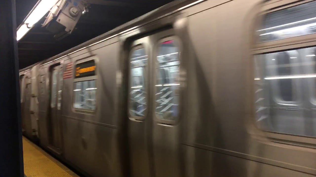 R160 Etrain to World trade Center, leaving Kew Gardens &ndash; Union Turnpike on the Xpress track