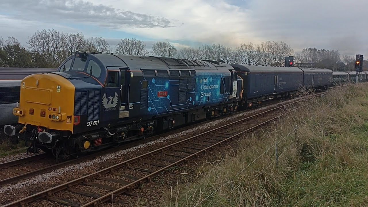 Classic locomotive Class 37 engine starting up, thrash & clag past Great Yarmouth Carriage Sidings