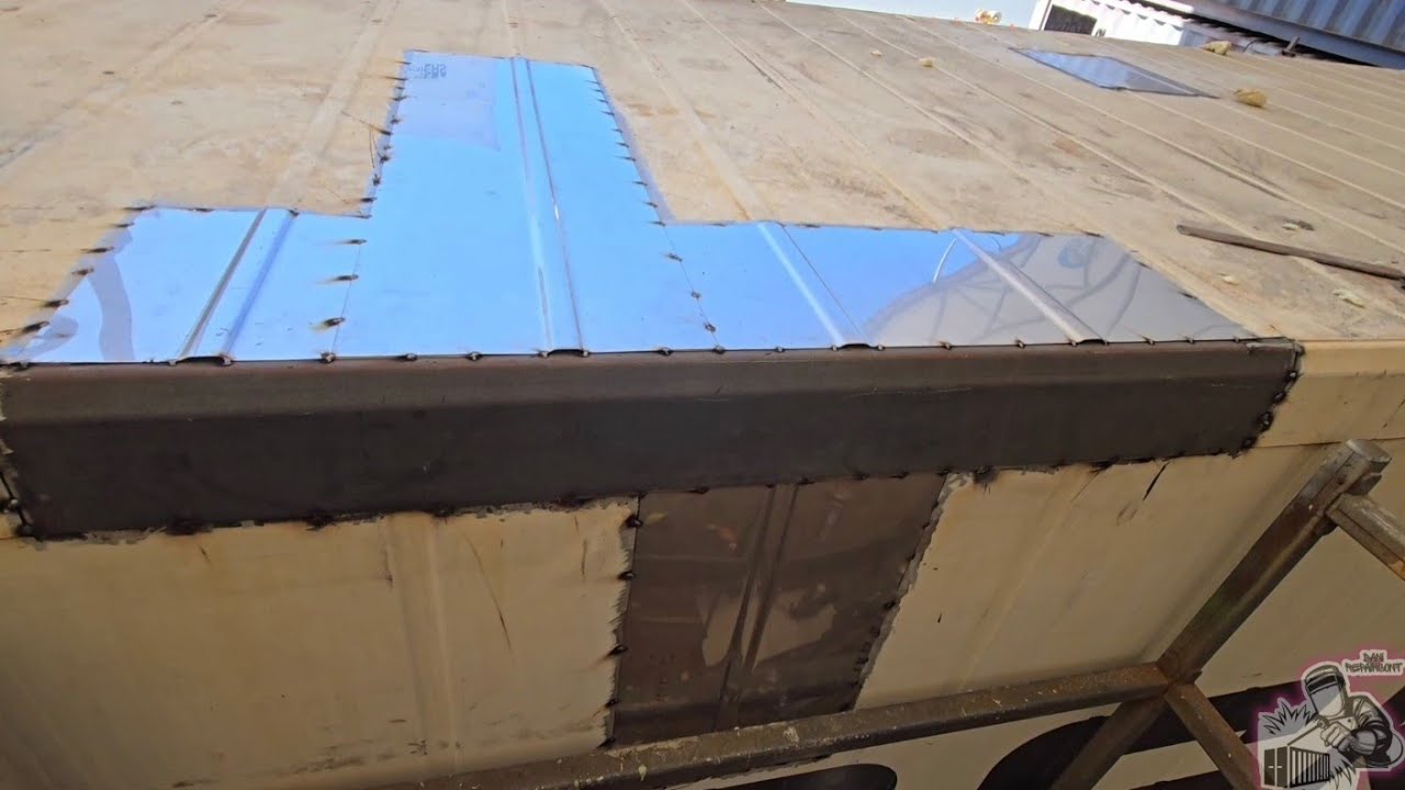 Welded patch and top rail section. Refrigerated shipping container repair.