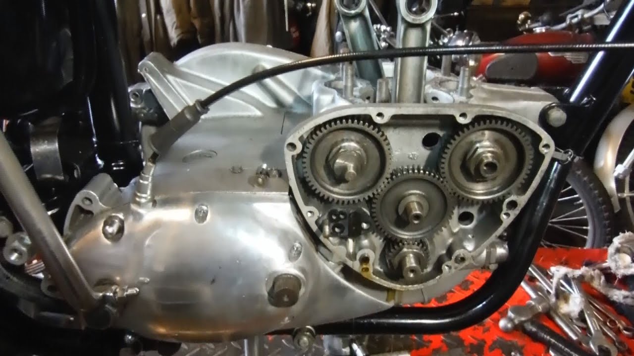 Triumph T120TT - Timing cover and oil pump removed, crank end feed bore looks small.