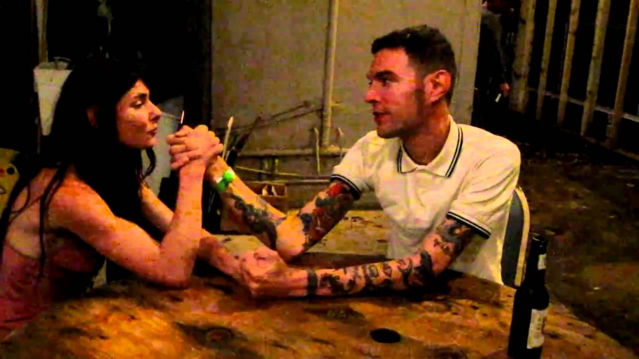 Erin and Arthur arm wrestle