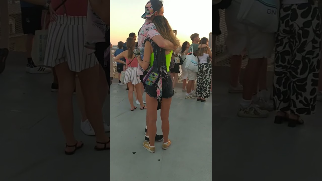 Tourist Couple watching the sunset at Setas de Sevilla #couple #tourist #setas #sunset