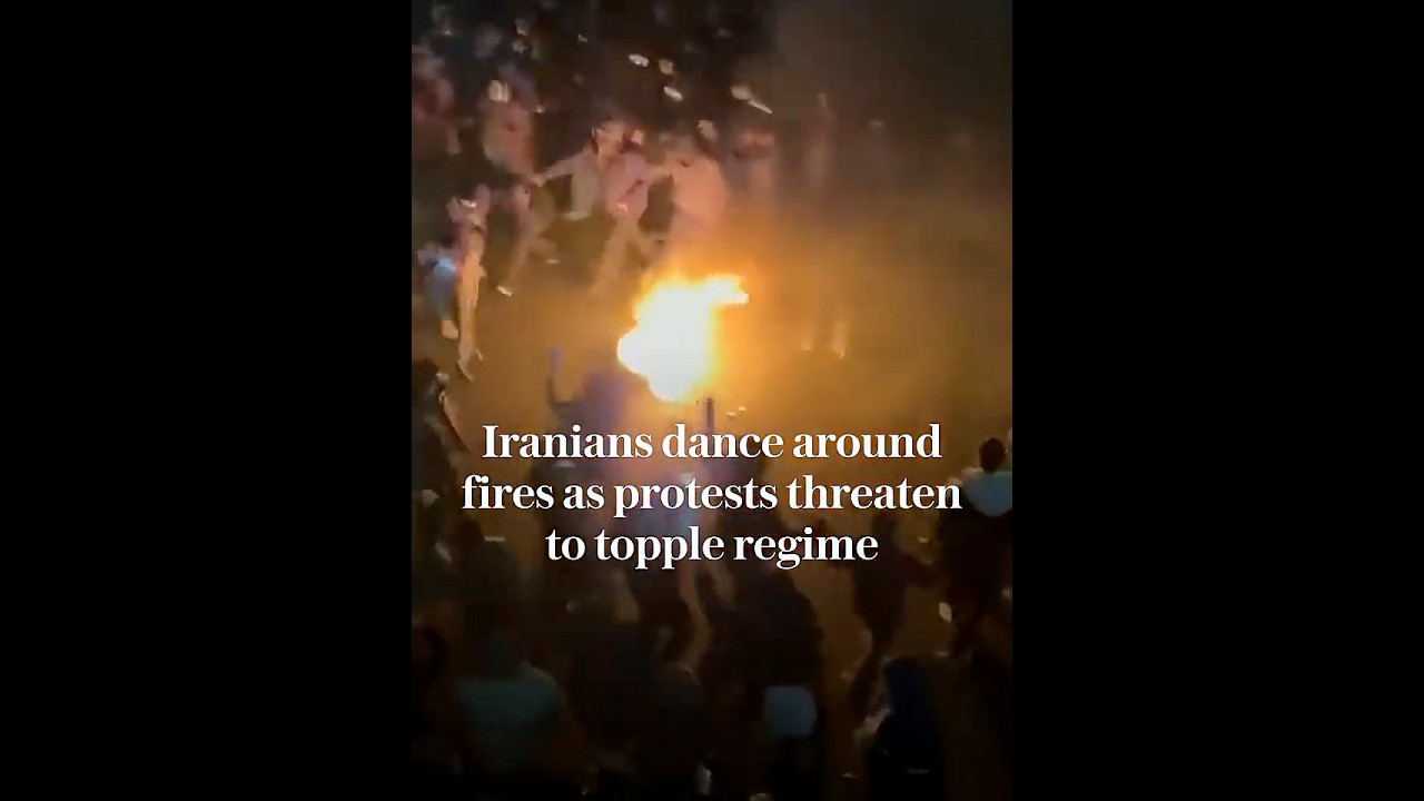 Iranian protesters dance around fires as Tehran protests threaten to topple regime