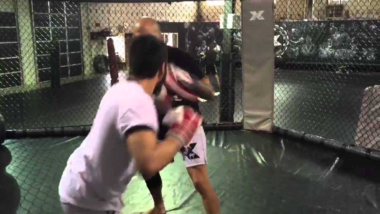 Randy doing pad work with Factory X head coach Marc Montoya