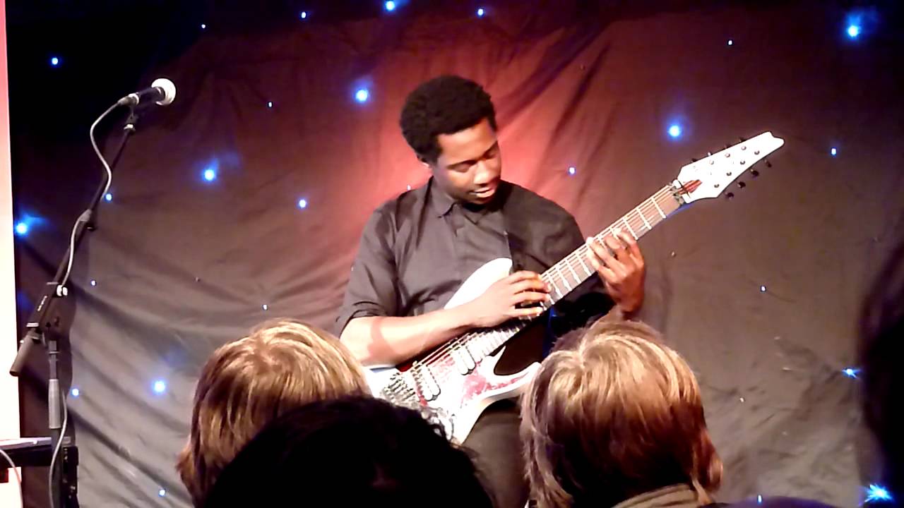 Tosin Abasi performing 