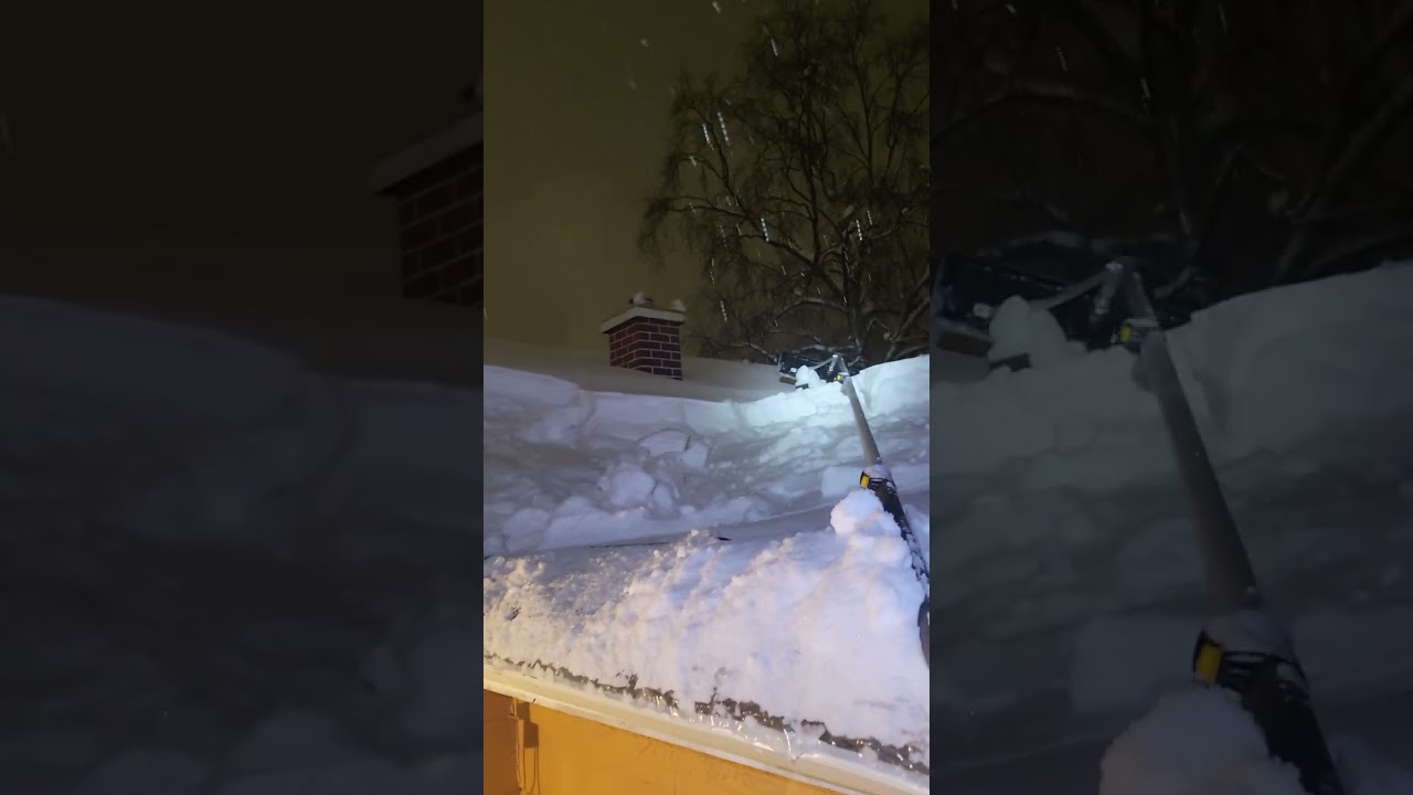 Raking snow off my house at night 