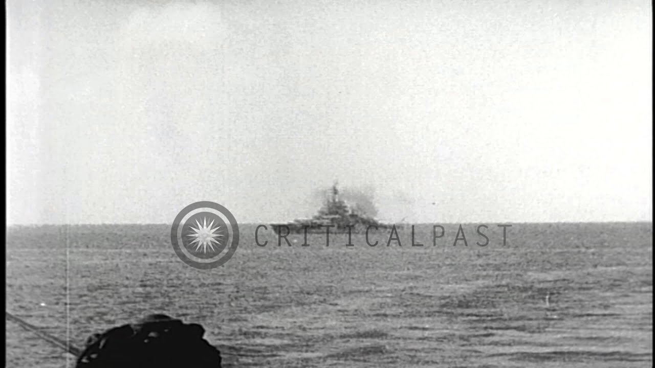 A US battleship fires guns at shore during the capture of Enewetak, Marshall Isla...HD Stock Footage