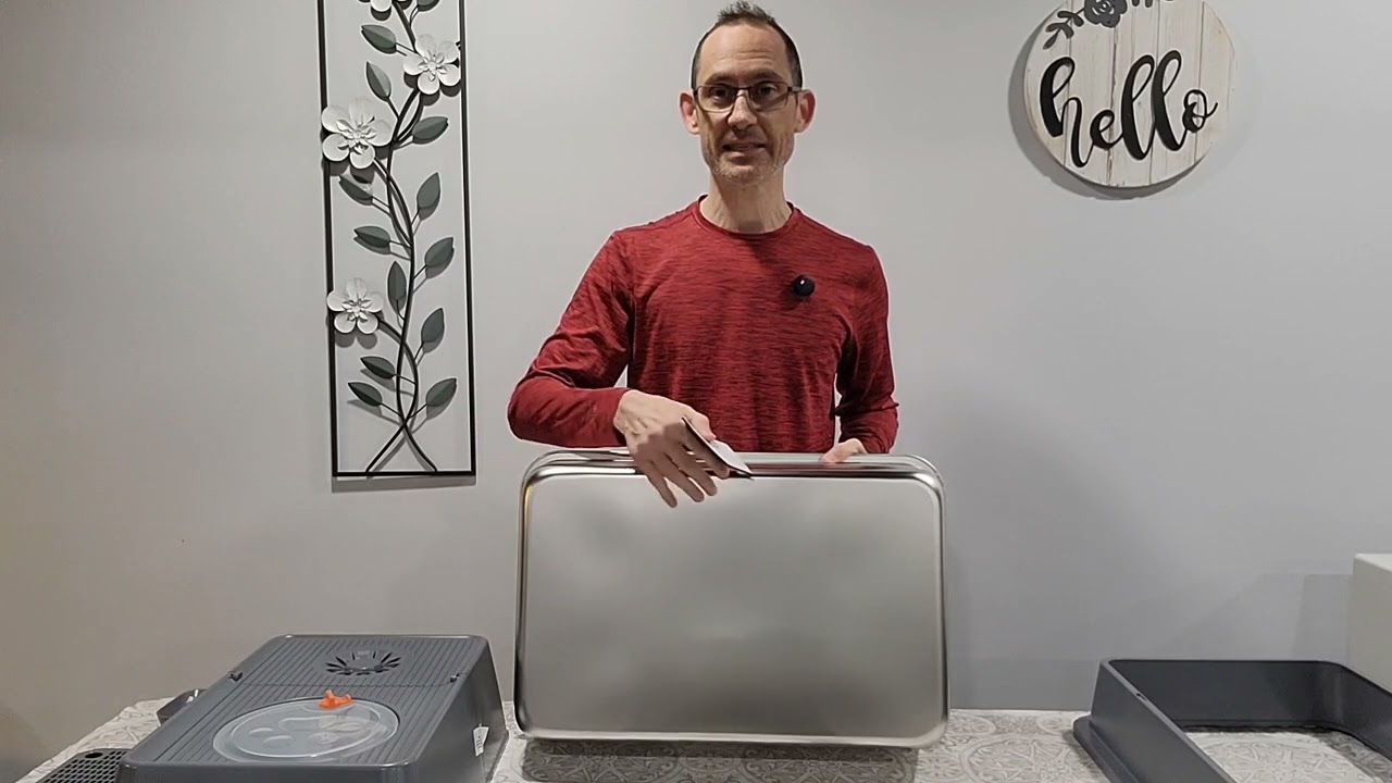 A large stainless steel cat litter box