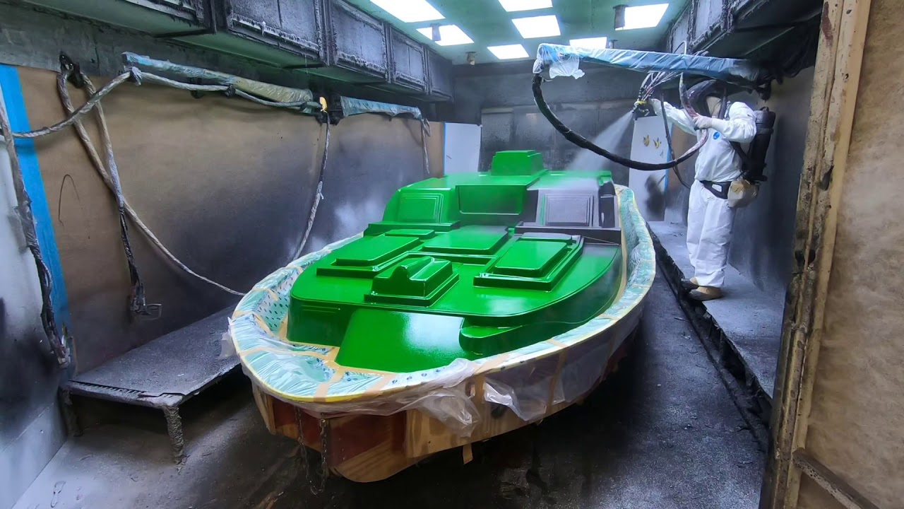 Spraying poly flake on a Ranger Boat top deck mold!