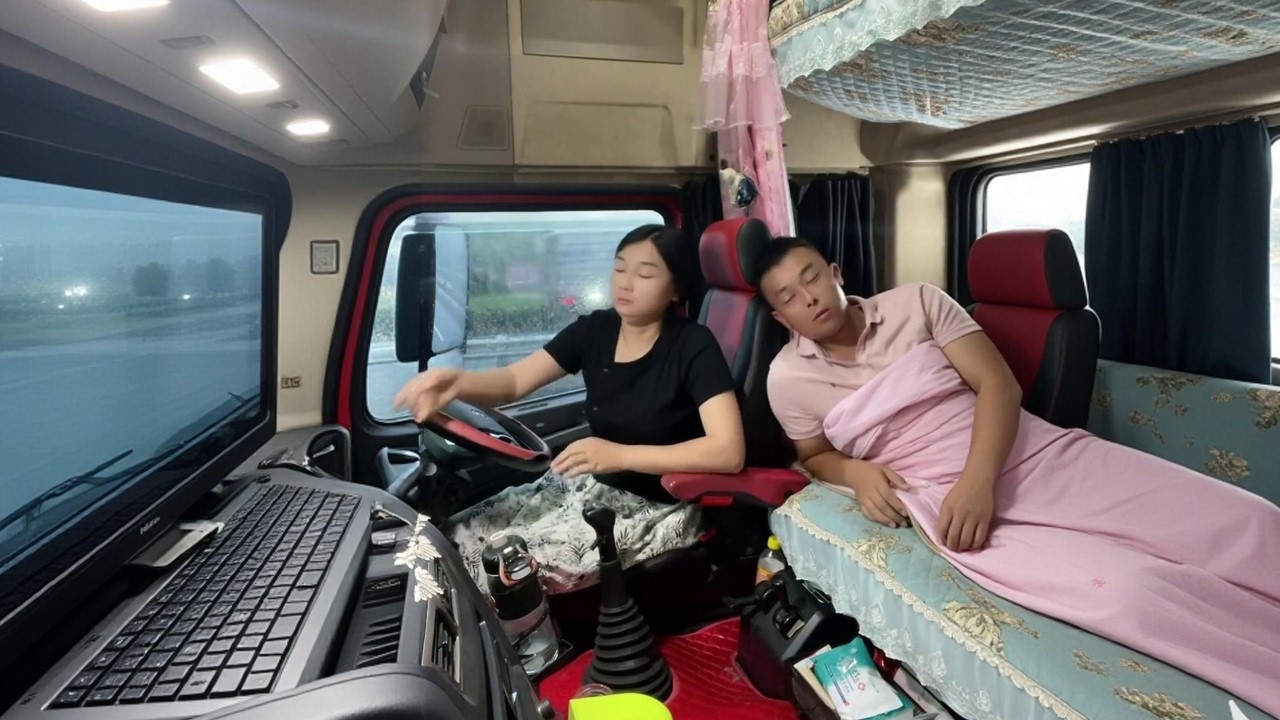 The long-haul trucking life of a couple the wife is tired, the husband drives.
