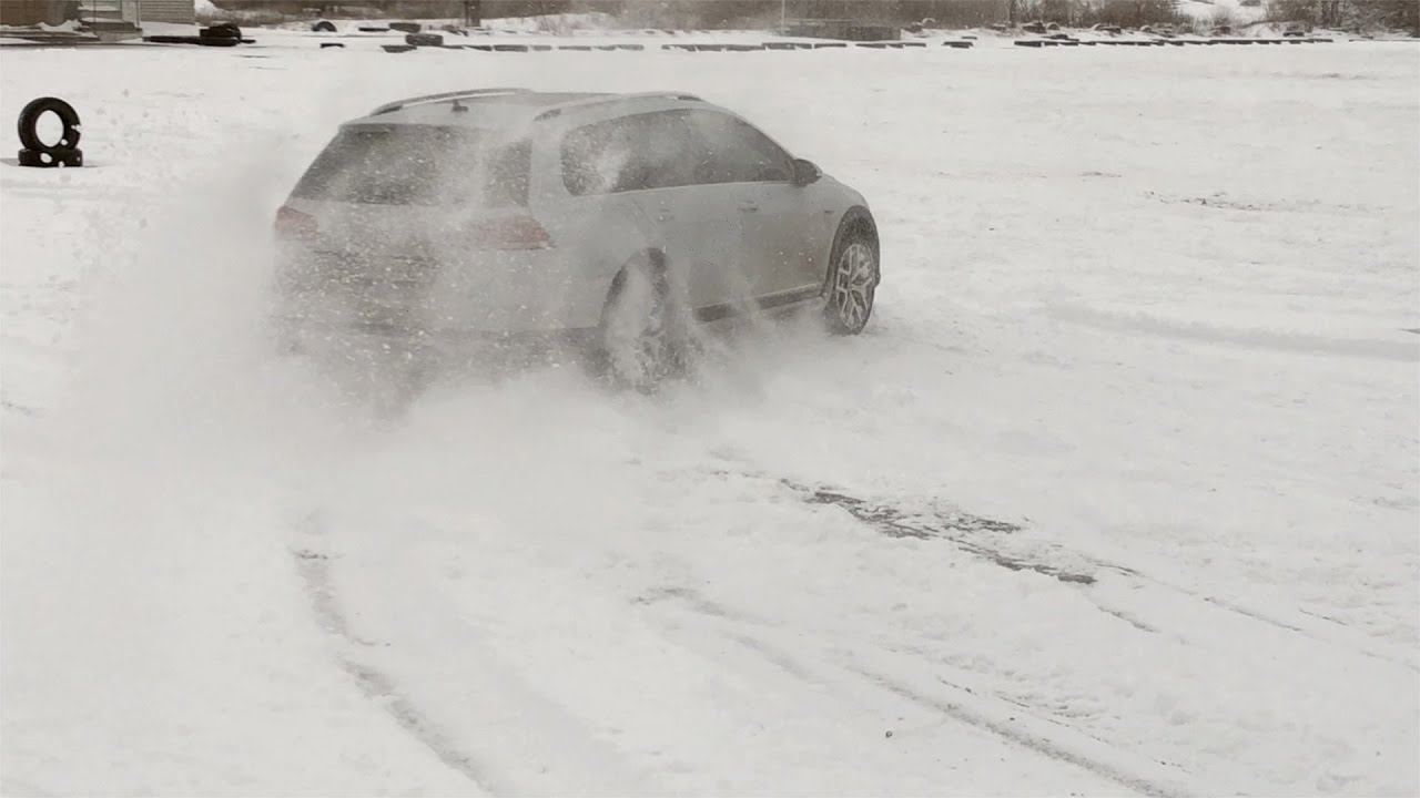 VW Golf Alltrack 2017 on a snowy ground shows its 4motion, ESP and ASR systems capabilities