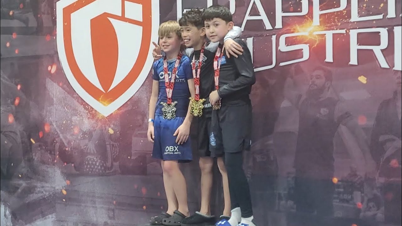 Julian recieving a bronze medal for the no gi division in his 10th jiu-jitsu tournament.