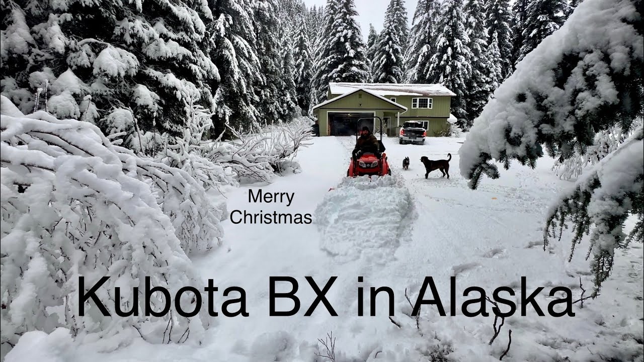Kubota BX plowing coastal snow in Alaska, with a Snow pusher . (Christmas edition)