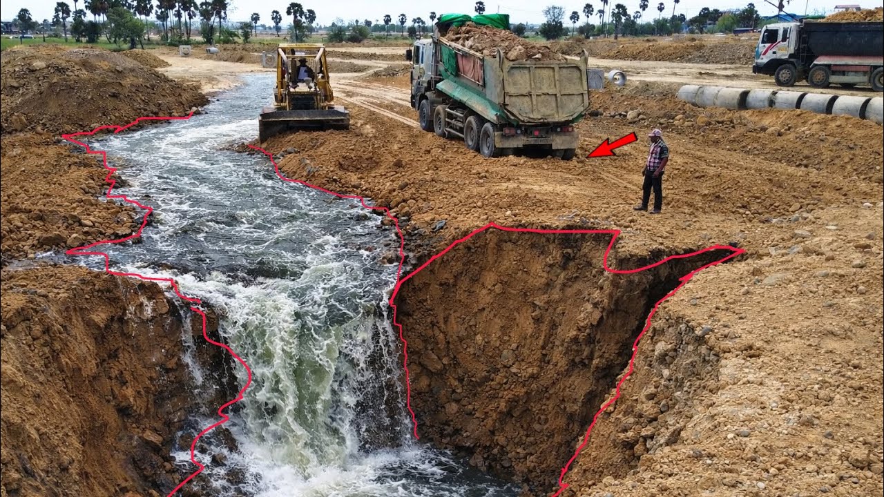 Incredible !! Dump Truck And Bulldozer KOMATSU Landfilling up Deep area project.