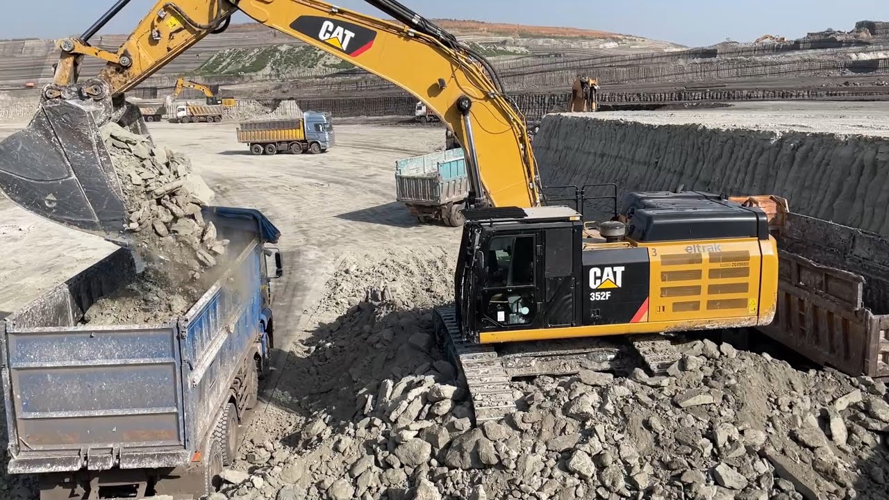 Caterpillar 352F Excavator Loading Trucks