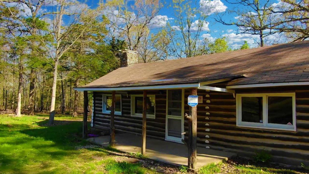 Two Bedroom LOG CABIN with OWNER FINANCING AVAILABLE on 21 Acres in MO - ID#JJB