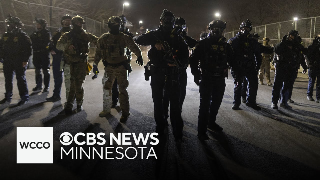 Cameras catch protesters attempt to jump fence outside Whipple building in Minneapolis